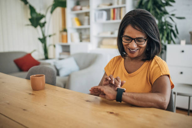 istock Mature woman checking smart watch 1726800049