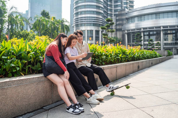 istock Young asian people using digital tablet in the city 1726817596