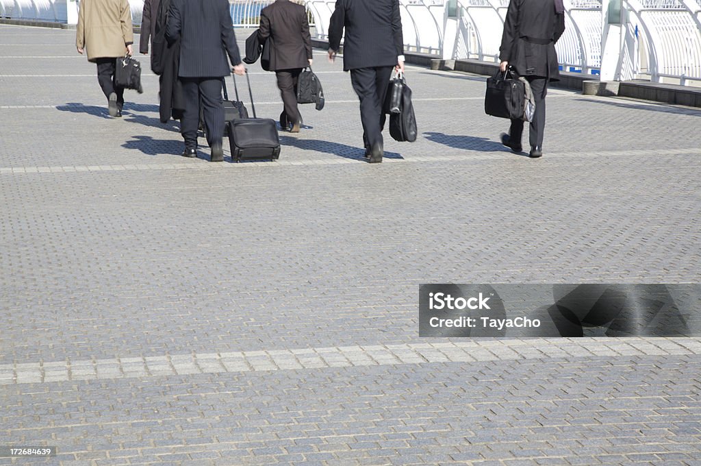 Group of six businessmen walking Six business walking away from camera with of copy space. Adult Stock Photo