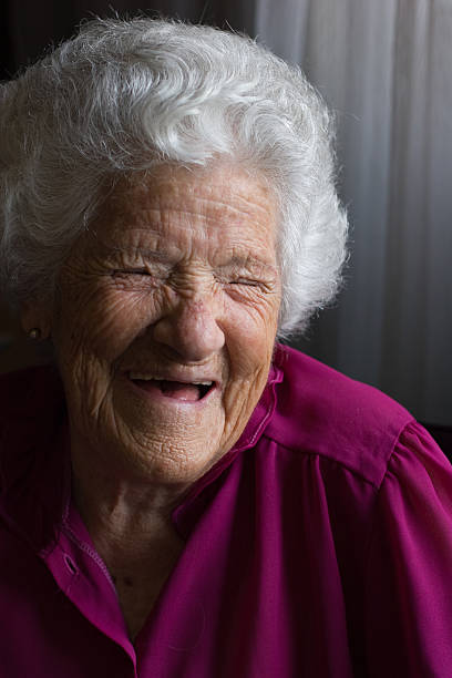 Smiling elderly woman stock photo