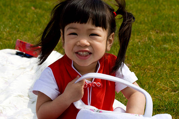 Portrait of Asian baby girl wearing traditional Chinese clothing