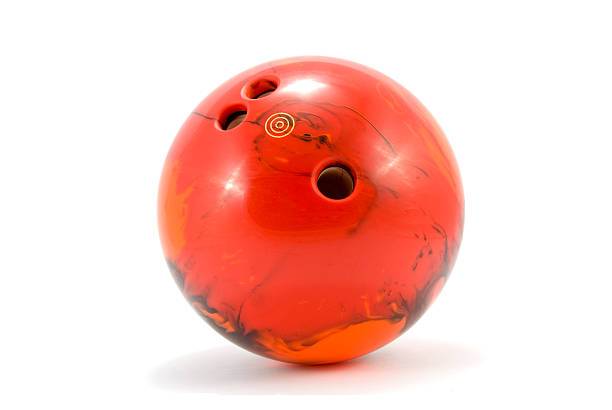 Photograph of red marbled bowling ball stock photo