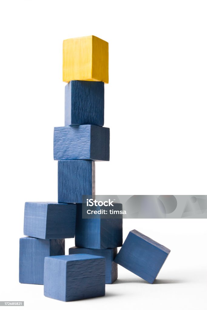 Stacked blocks Tower of stacked cubes with a yellow cube sitting on top. Similar concepts with blue cubes: Achievement Stock Photo