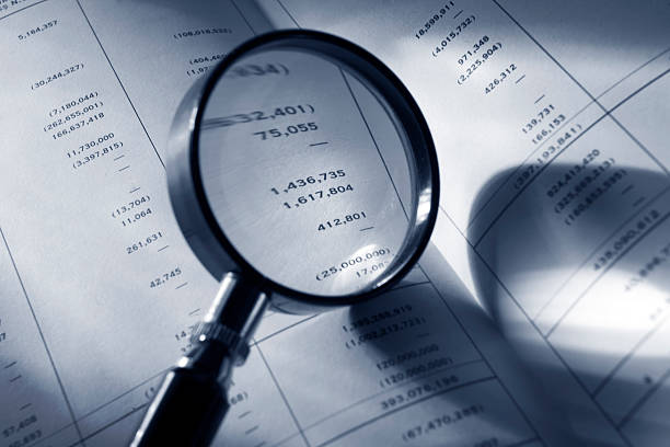 istock Finance: Magnifying Glass on Financial Report 172686558