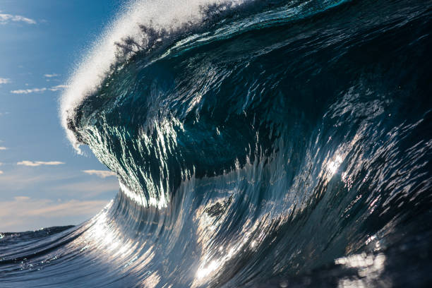 istock Powerful large blue ocean wave breaking in bright morning light 1726867547