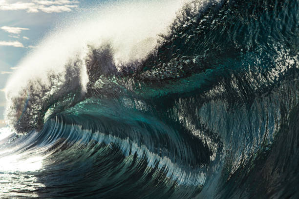 istock Powerful large blue ocean wave breaking in bright morning light 1726868583