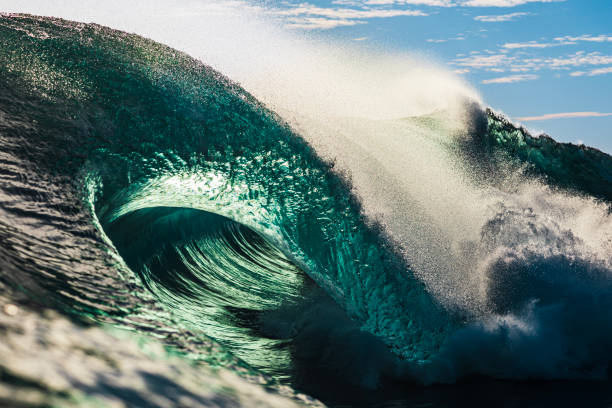 istock Powerful large aqua marine ocean wave breaking in bright morning light 1726869123