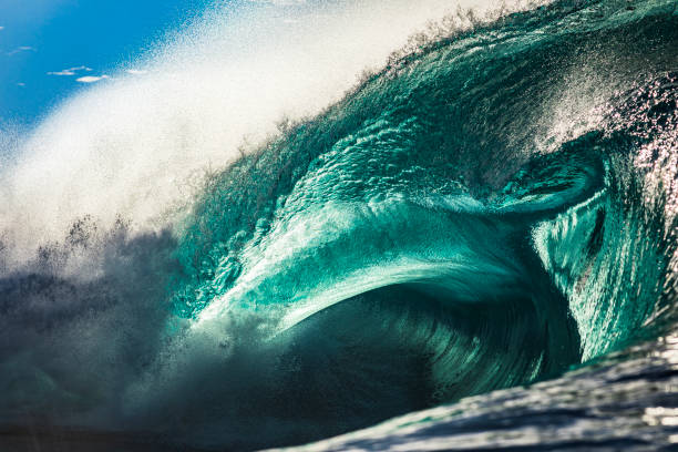 istock Powerful large aqua marine ocean wave breaking in bright morning light 1726869631