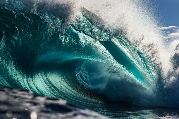 istock Powerful large aqua marine ocean wave breaking in bright morning light 1726874352