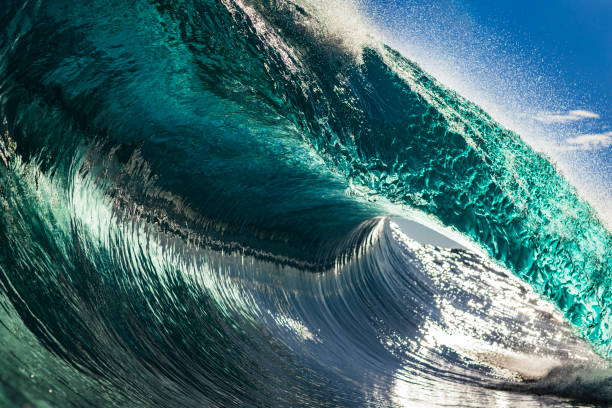 istock Powerful large aqua marine ocean wave breaking in bright morning light 1726874369