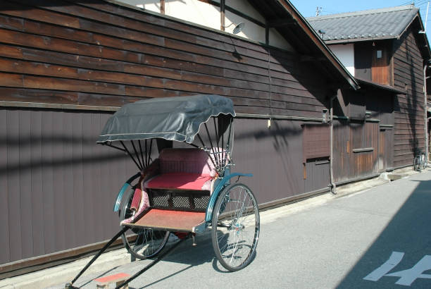 istock Rickshaw on sidestreet in historic district of old houses 172687666