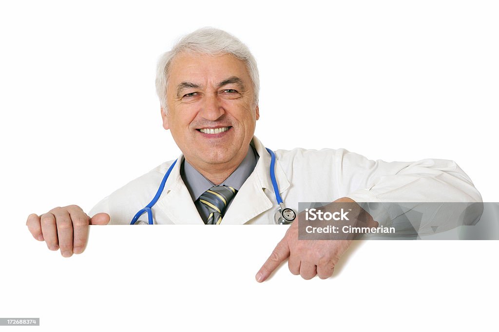 Male doctor holding a blank sign (on white) "Doctor holding blank sign showing something by his index finger, isolated on white. You can add extra white space with your message to the bottom." Doctor Stock Photo