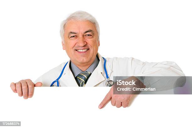 Male Doctor Holding A Blank Sign Stock Photo - Download Image Now - Doctor, Empty, Men