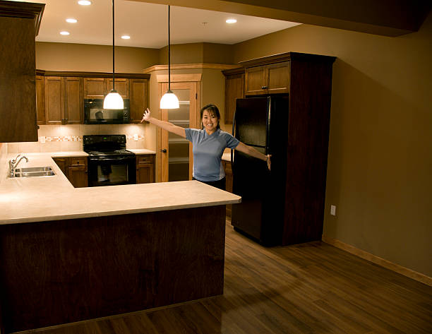 The kitchen features beautiful plants, captivating wall art, and soft lighting for a comfortable vibe