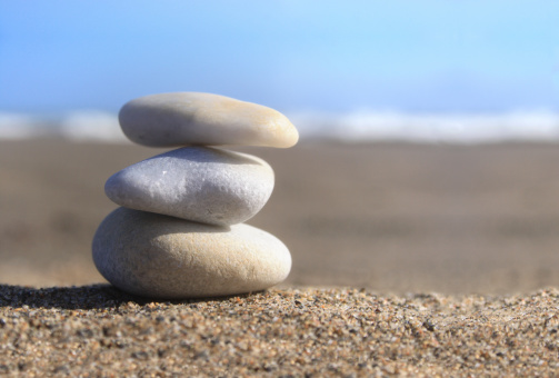 three stones on the sand