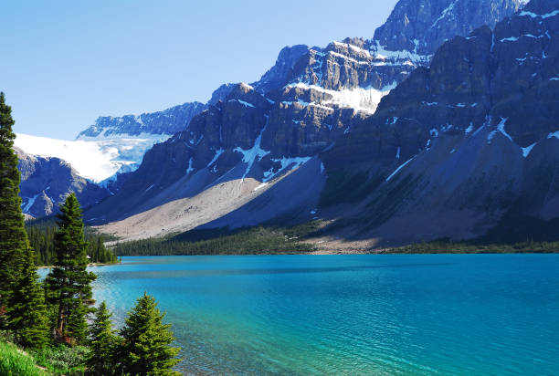istock Beautiful, serene Bow Lake beside snow covered mountains.  172689356