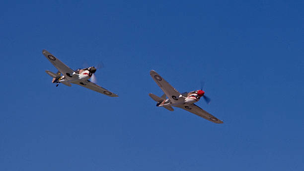 istock P-40 Warhawk World War II Fighters Fly Overhead Blue Sky 172689657