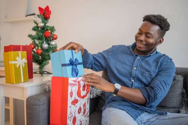istock Man celebrating Christmas Eve at home 1726900667