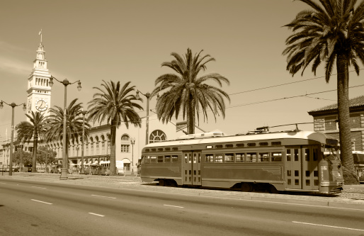 Retro style photo of the Ferry Building and Trolley at the Embarcadero in San Francisco, California. 