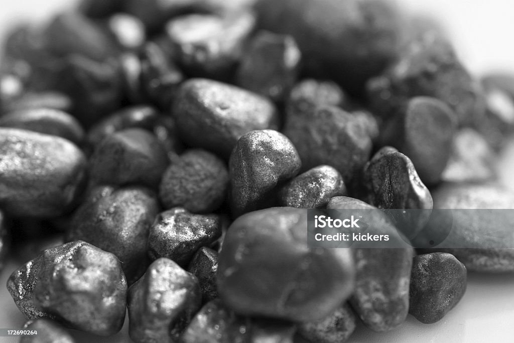 Silver on white "Pebbles of silver, isolated on white" Bringing Home The Bacon Stock Photo