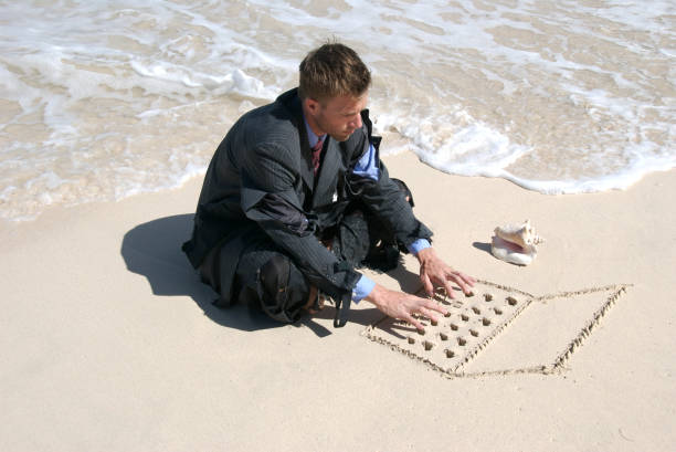 istock Castaway Businessman Sits at Mobile Office 172690461