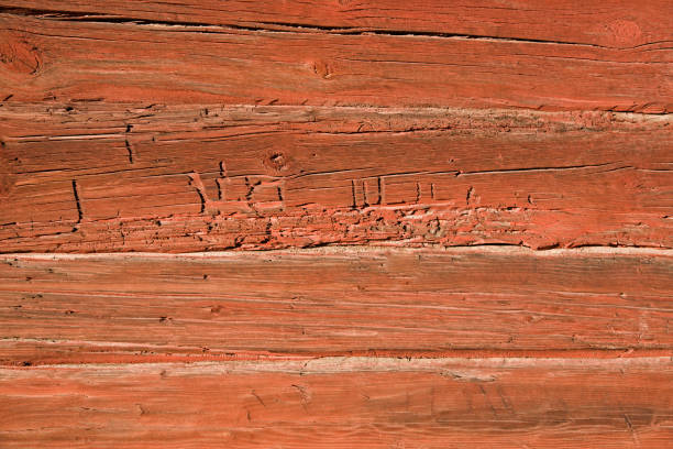 istock Old red worm eaten wooden wall 172690945