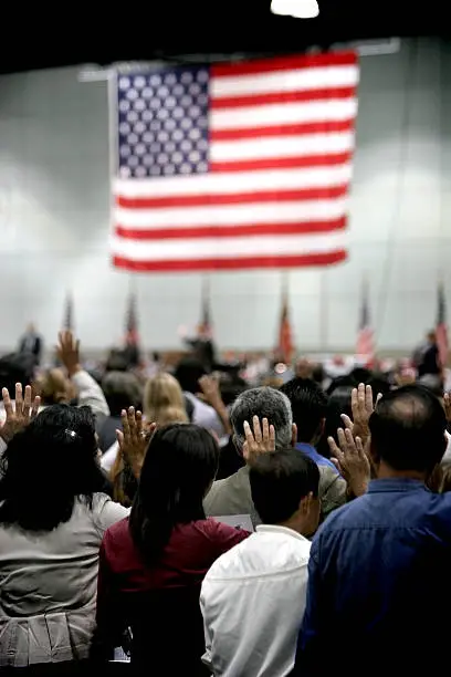 New Immigrants taking their oath to become American Citizens.