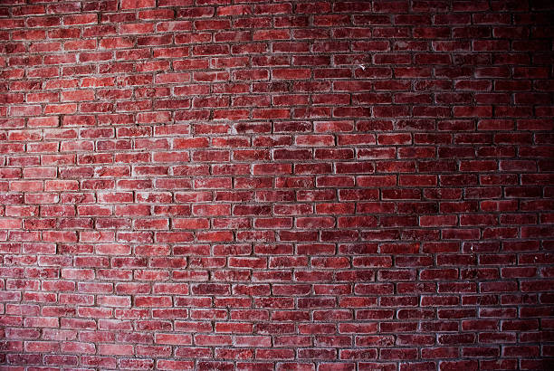 istock Photo of a rustic, bare, red brick wall, no subjects present 172691262