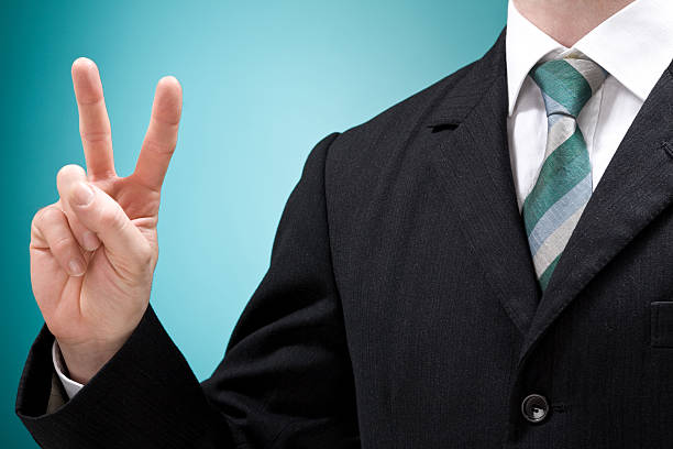 istock business man with necktie success doing ok sign 172691778