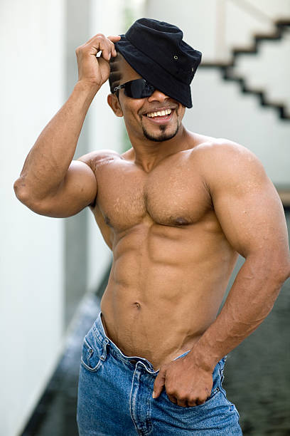 athlete happy with muscle body and hat stock photo