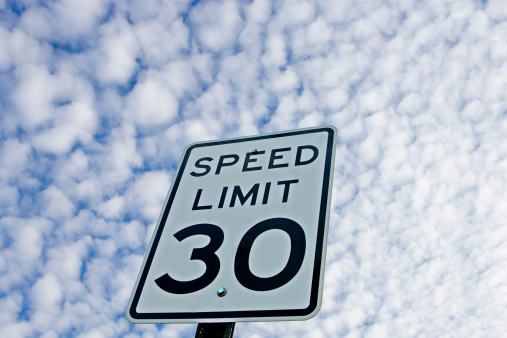 Speed limit sign taken from ground looking up at sky