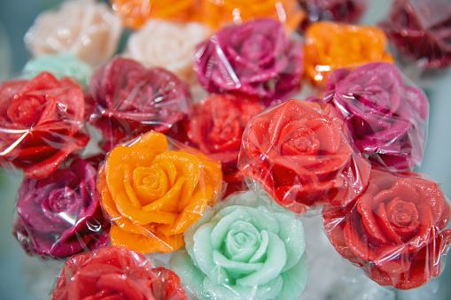 Bouquet of lollipops in the form of roses flowers closeup