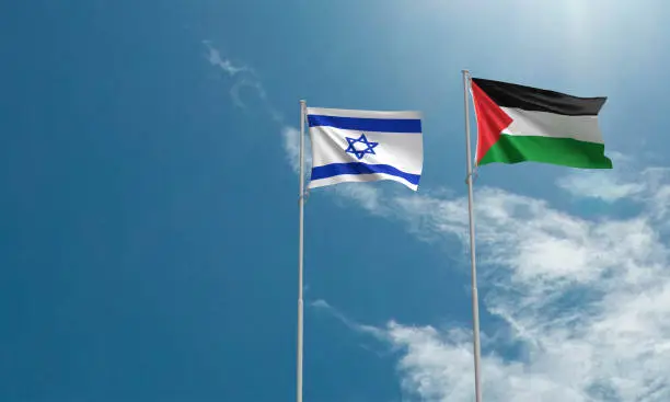 Photo of israel palestine flag waving blue sky