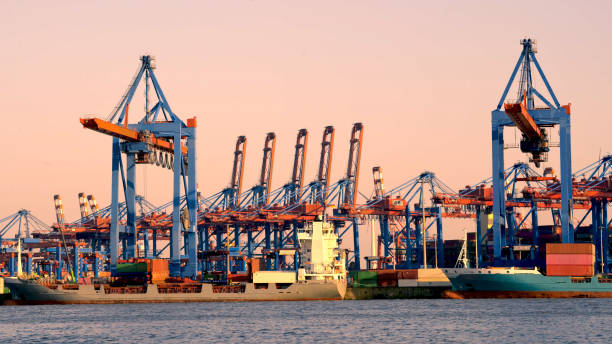 istock Cargo crane in sea port with containers 1726926847