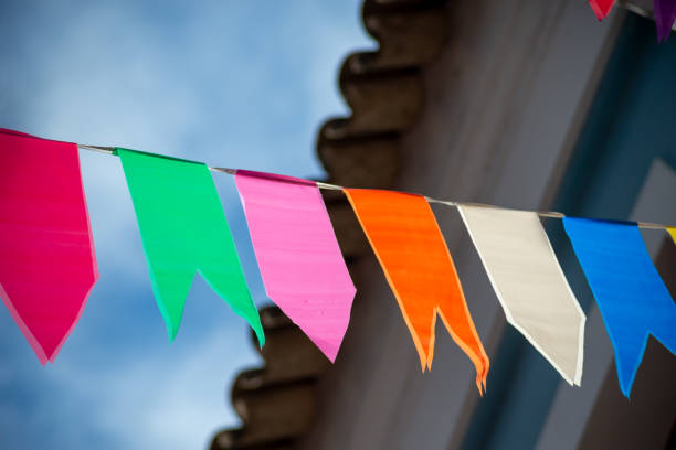 istock Festive decoration flags of different colors hanging with string. 1726927734