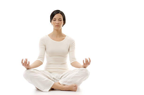 Woman meditating on a white background.