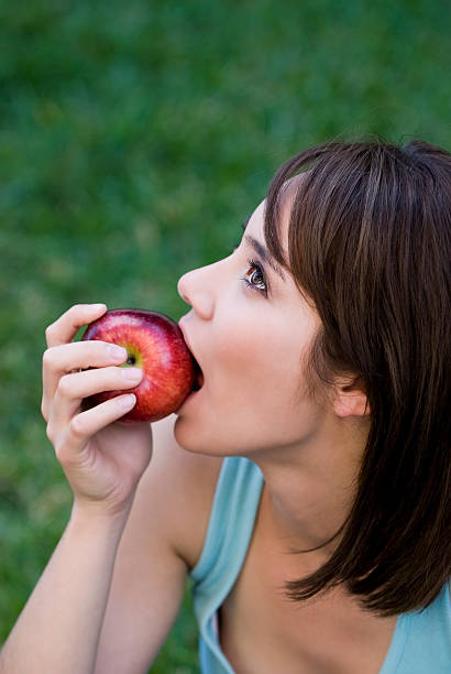 istock Girl with an apple 172693057