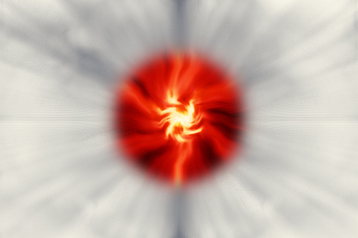 Gray unevenness spreads radially on a white background. An image of a strong red flame burning in the center.