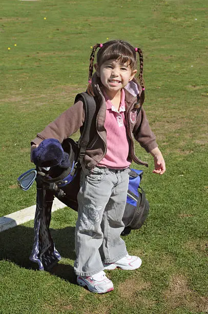 Young girl holding her golf clubsPlease see some similar pictures from my portfolio: