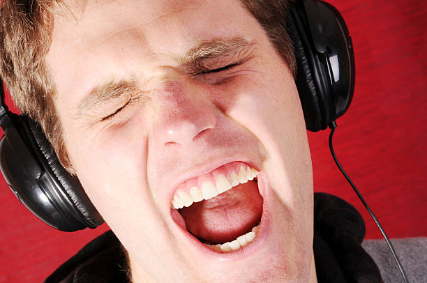 young man singing along, well maybe yelling along