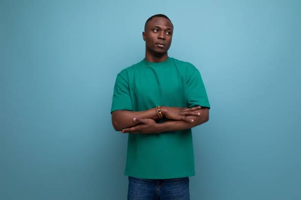 istock young handsome african man dressed in t-shirt doubts on isolated background with copy space 1726955896