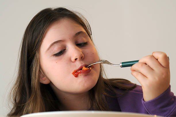 Eating pasta stock photo