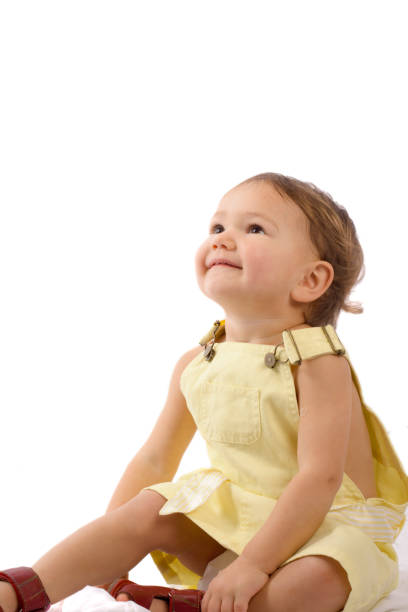 The child, surprised at something shows his hand