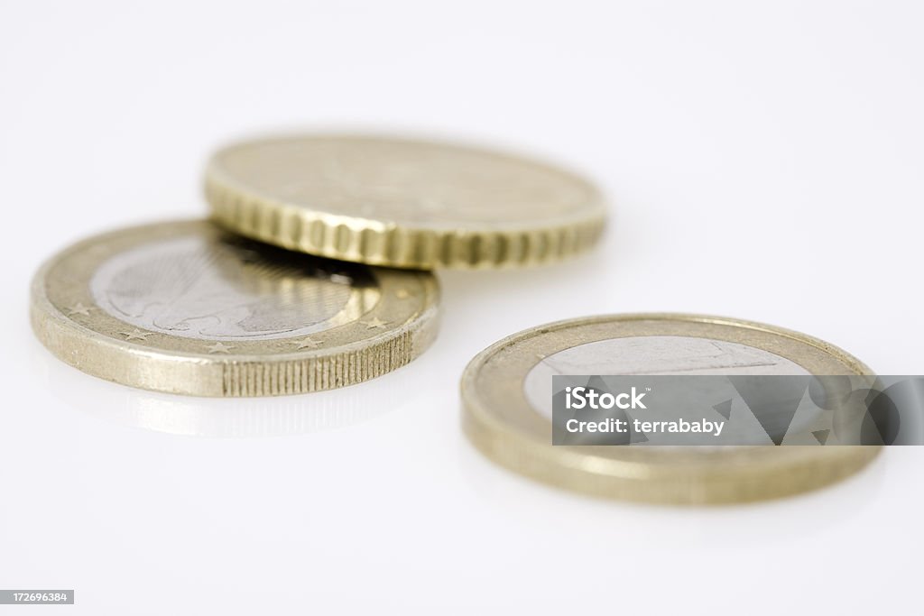 Euro Coins "Three Euro and fifty cent. Close-up of three German Euro coins, isolated on white. shallow dof." Cent Sign Stock Photo
