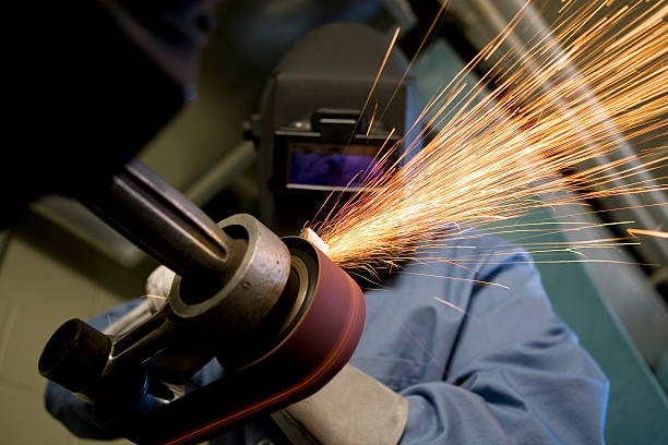 Man Grinds Metal stock photo