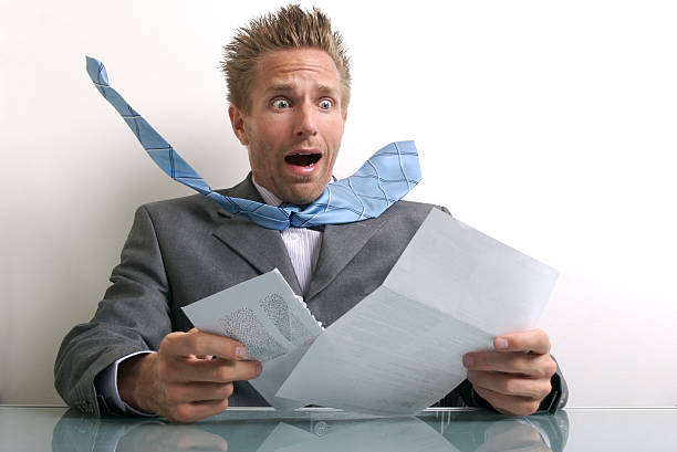 istock Stressed Businessman Office Worker Opening Envelope at Desk 172696956