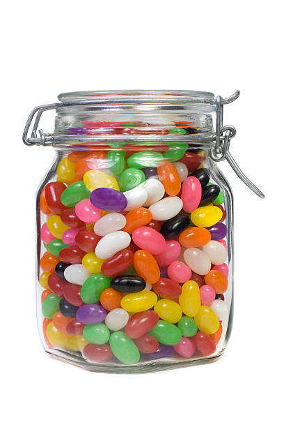 Jar of Jelly Beans Mason jar filled with colorful jelly beans jellybean stock pictures, royalty-free photos & images