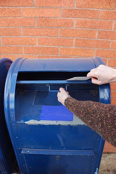 Mailing an envelope Hand in MailboxPlease see other pictures from my portfolio: cebolla stock pictures, royalty-free photos & images