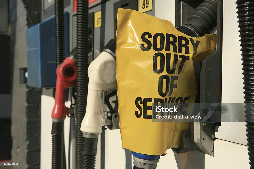 Out of Service A gas pump with a yellow out of service bag over the handle. Out Of Service Stock Photo