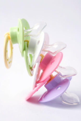 stack of four pacifiers
